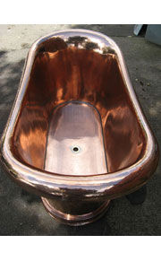 A repaired and polished genuine antique roll top copper bath