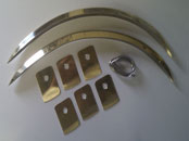 A new pair of front wing/fender mouldings with un-soldered tabs for a 1952 Lagonda Drophead