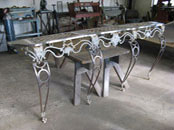 Antique wrought iron bench and console