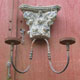 One of a pair of double candle wall sconces with genuine carved wood and embossed steel strips