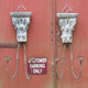 A pair of double candle wall sconces with genuine carved wood and embossed steel strips