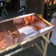 Topside of one of the polished copper basins