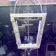 Large brass French lantern, door hanging in front of workshop