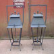 A pair of aged steel lanters with opening lids