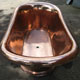 Top/inside of original French polished copper roll top bath, finished