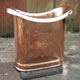 Side view showing seam of original French polished copper roll top bath, finished