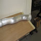 New aluminium exhaust cladding for a WO Bentley Speed Six, showing a subtle concave dimple