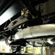 Finished WO Bentley exhaust with new aluminium cladding mounted on car, mid section close up offside