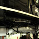 Finished WO Bentley exhaust with new aluminium cladding mounted on car, offside