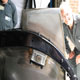 Extra large Bentley Speed Six stainless steel fuel tank during construction in car, nearside