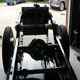 Extra large Bentley Speed Six stainless steel fuel tank during construction in car with chassis