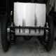 Extra large Bentley Speed Six stainless steel fuel tank during construction in car, rear low