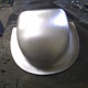 The newly completed aluminium Jaguar D-Type mirror cowling