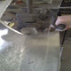 Swaging the front return on this aluminium Jaguar D-Type mirror cowling with a jenny