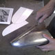 Shaping the aluminium for this Jaguar D-Type mirror cowling with a flipper