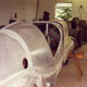 The red Lagonda V12 Le Mans aluminium body skin being made at our workshop