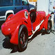 The red 1939 Lagonda V12 Le Mans, now owned by Jay Leno, offside rear, in the USA