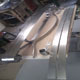 The newly fabricated 1930's Packard 12 front bumper set with the rear during construction