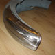 Repairs with new section to a Triumph Thunderbird mudguard, side